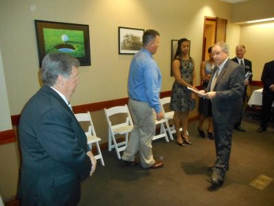 ASL Program Coordinator Tom Lamothe lining up Frank Beede and Keisha Johnson