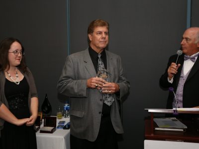 Georgia Shea, ASL Founder Eddie Beaudin with Lifetime Appreciation Award and M/C Rick Marchoke