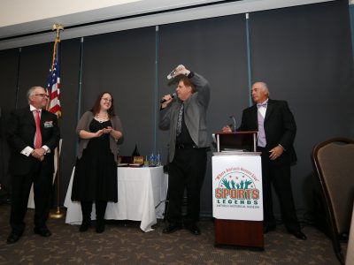 ASL Founder Eddie Beaudin showing Lifetime Appreication Achievement award over head