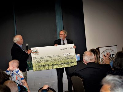 Steve Parks presenting the Alumni check to Tom Lamothe