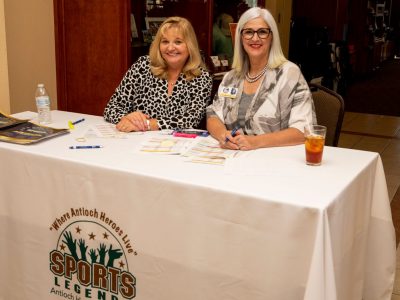 Antioch Sports Legends Founder Eddie Beaudin's wife, Dorothy Beaudin and Antioch Sports Legends Super Volunteer Kris Delmonte at the registration table.