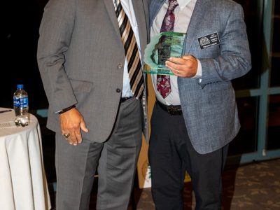 2018 HOF Coach Lou Panzella presents 2019 Inductee Dennis Luquet his Hall of Fame award.