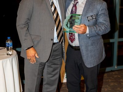 2018 HOF Coach Lou Panzella presents 2019 Inductee Dennis Luquet his Hall of Fame award.